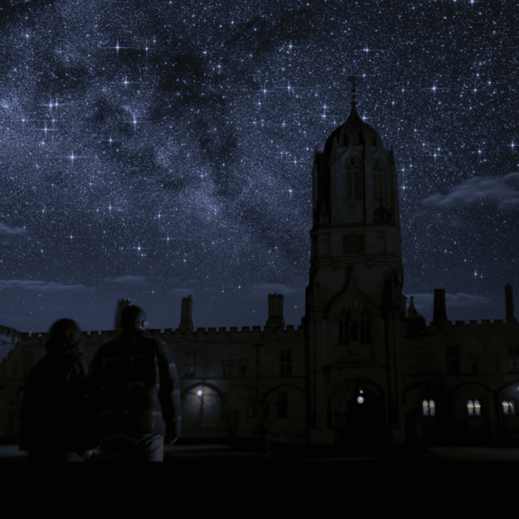 Sci-Fi Series Like Tomorrow & I: 3 Body Problem - two people are standing in front of a building under a starry sky