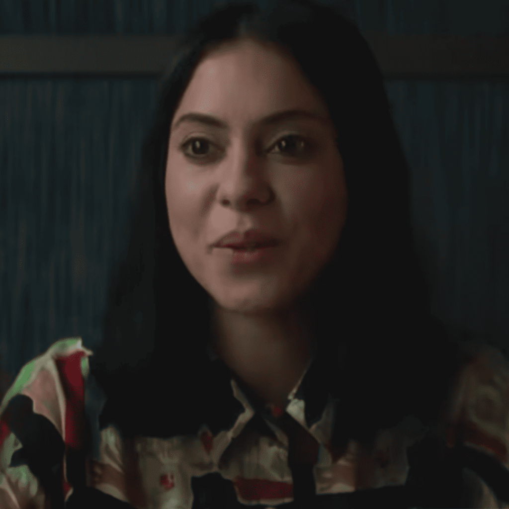 Mind-Bending Plot Twists - a person with black hair and a floral shirt