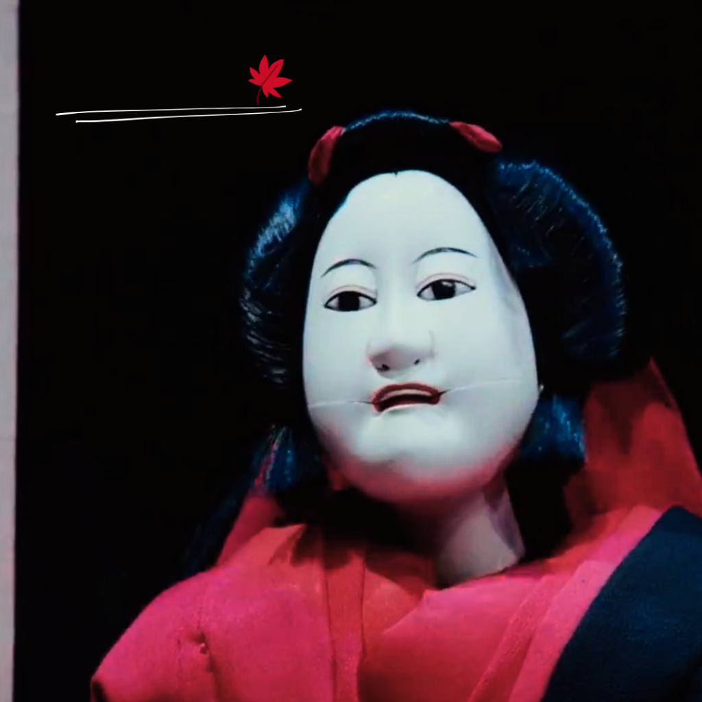 Asura Episode 1 - A doll with a red scarf on its head