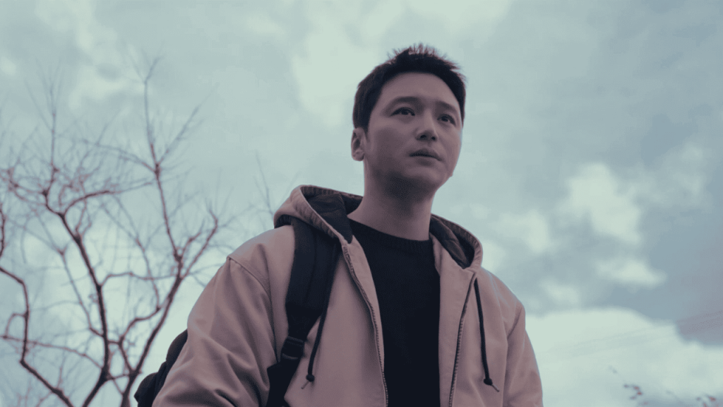 Best Korean Drama of 2024 -Go Jeong Woo in a hoodie stands in front of a cloudy sky