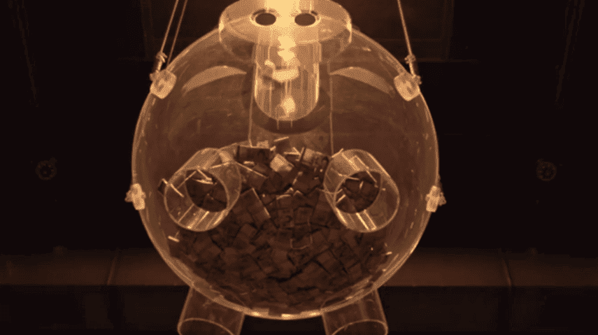 Squid Game 2: An image of glass piggy bank filled with cash