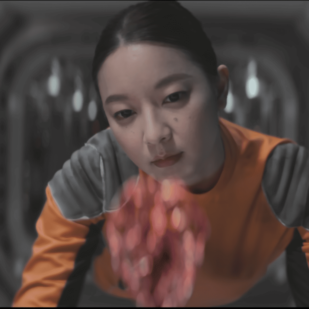 Tomorrow & I: A person in an orange shirt looking at a 3D printed heart