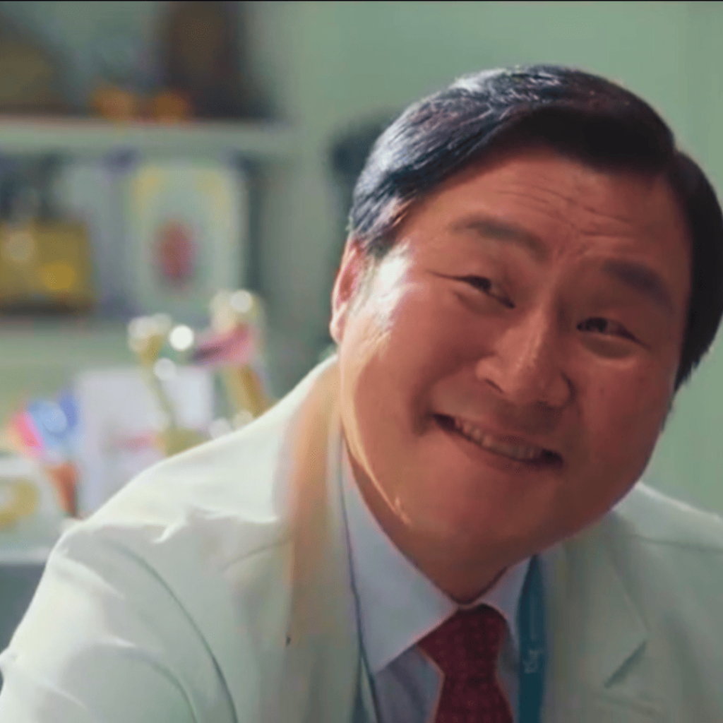 Trauma Code: A person in a white coat is smiling