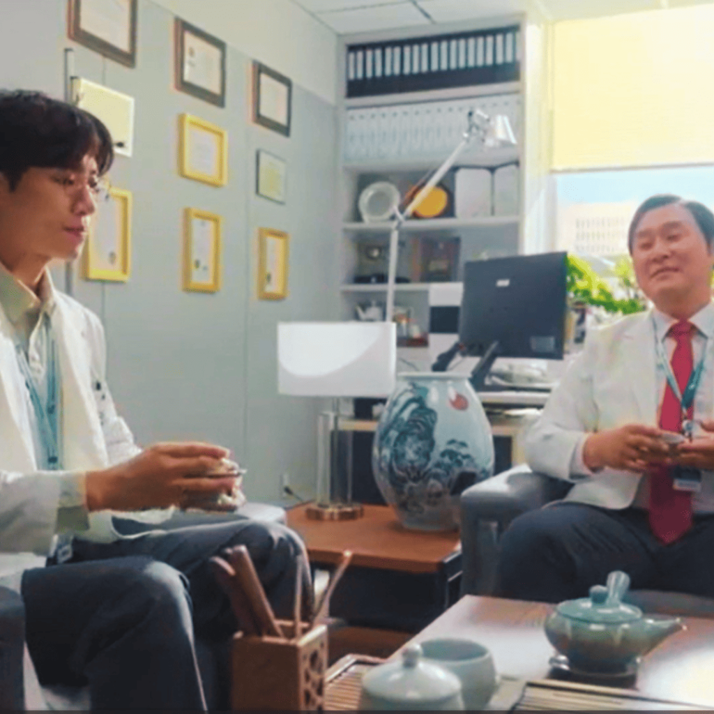 Trauma Code: two individuals in white lab coats sitting in chairs