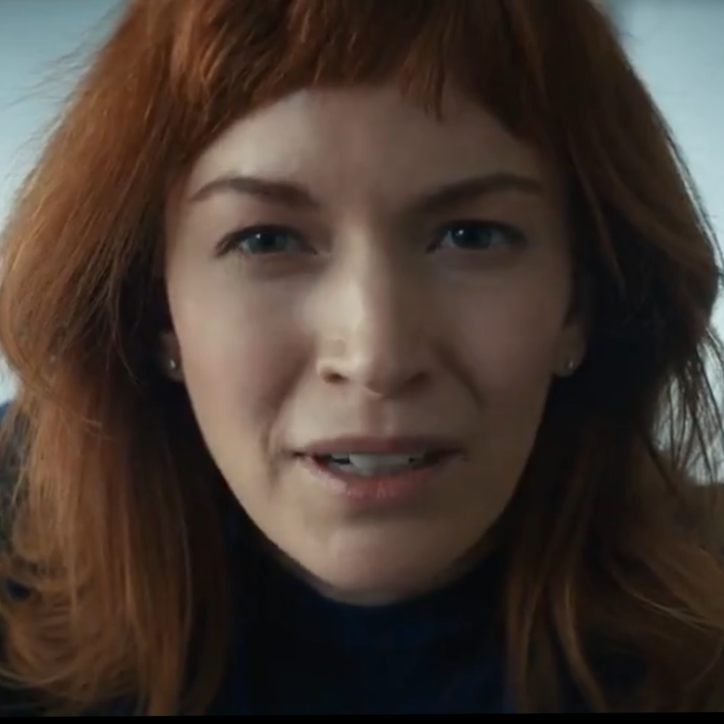 Severance Season 1 Ending Explained: a person with red hair is looking at the camera