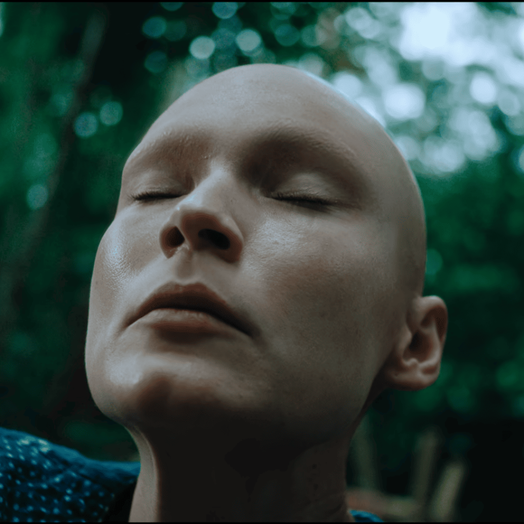 Apple Cider Vinegar Review: a person with their eyes closed in the woods