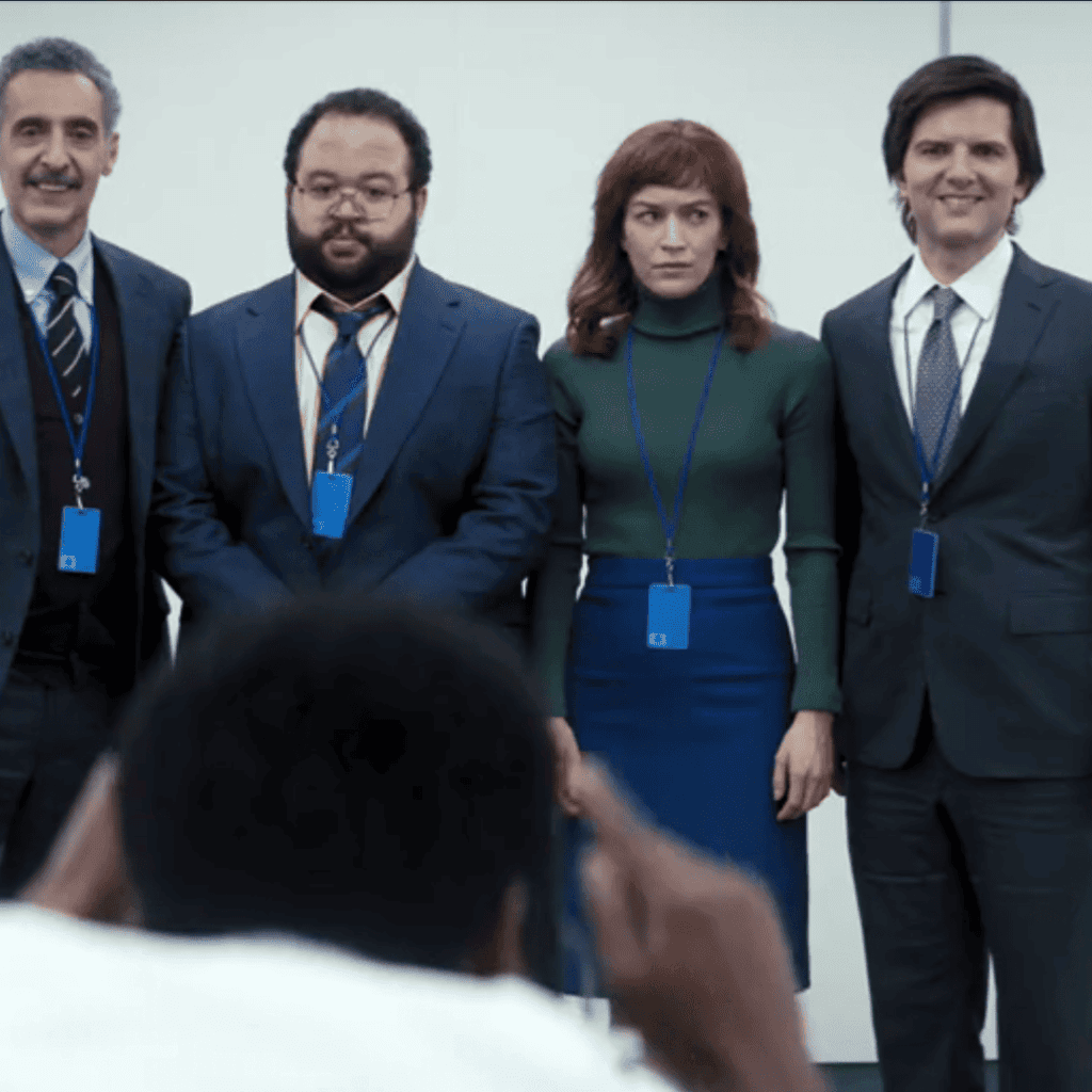 Severance Season 1 Review: A group of people in suits and ties standing next to each other.