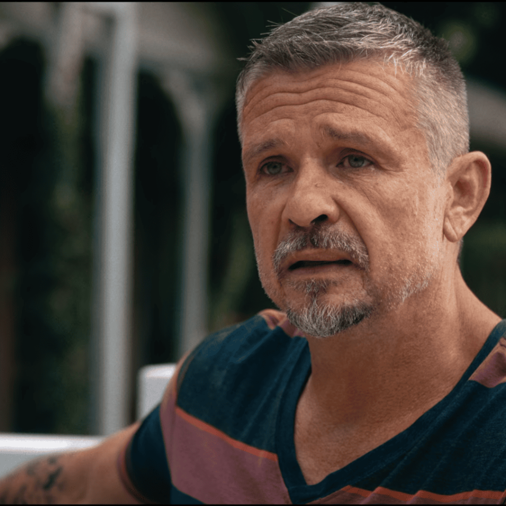 Apple Cider Vinegar Review: a person with a tattoo on their arm and a striped shirt