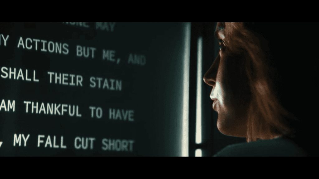 Severance Season 1 Review: A person is looking at the words on the screen.