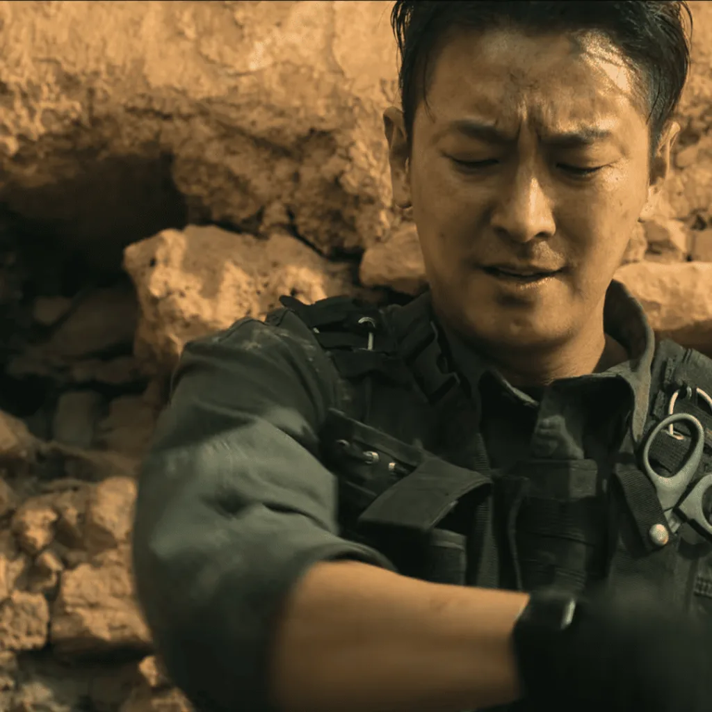 Trauma Code Review: A person in a military uniform holding a gun