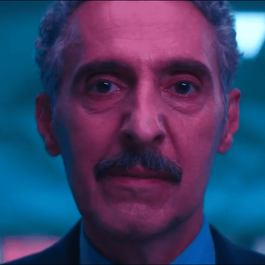 Severance Season 1 Review: A person with a moustache in a suit and tie