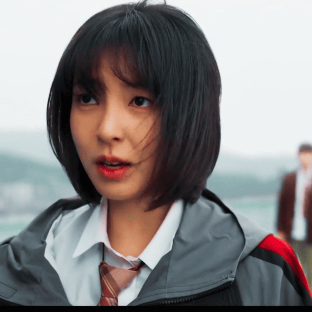 Study Group K-Drama Review: A person in a school uniform is standing in front of a group of people.