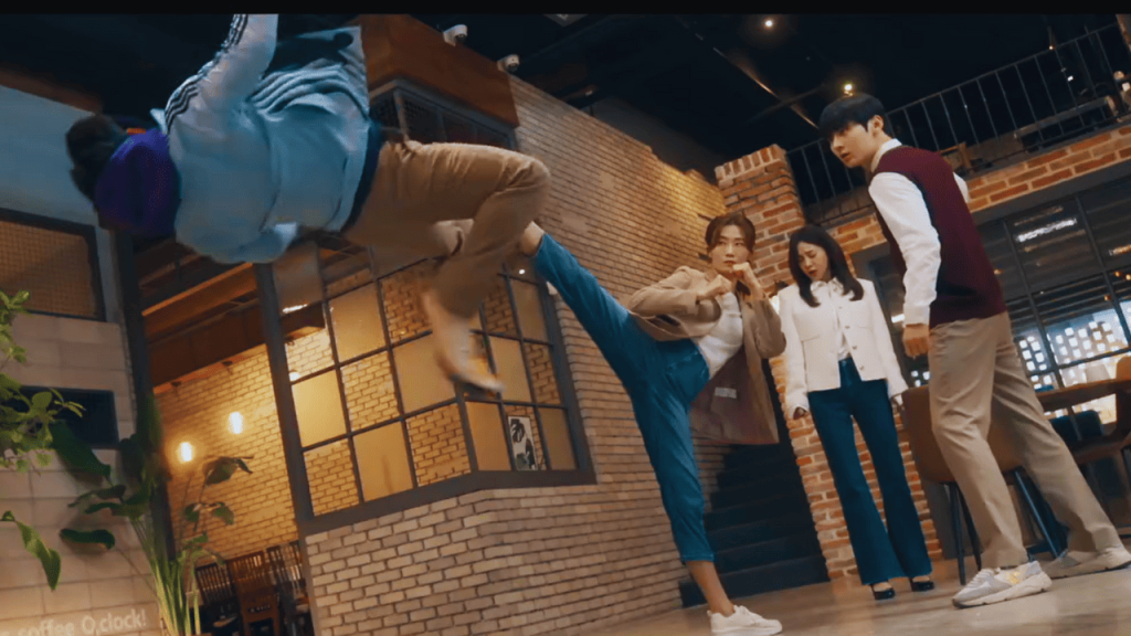 Study Group K-Drama Review: a group of people standing around a person doing a kick