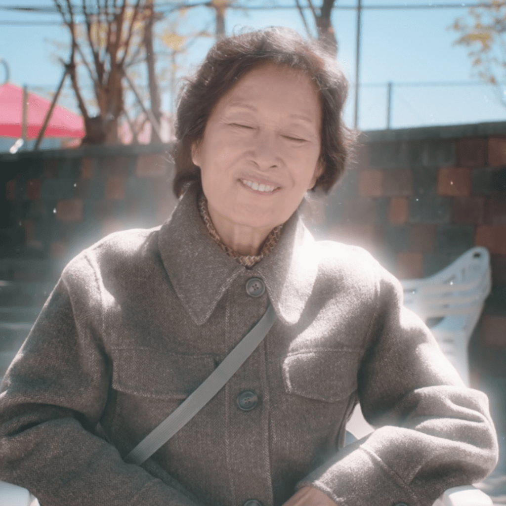 Heavenly Ever After: A person sitting on a bench with their eyes closed.