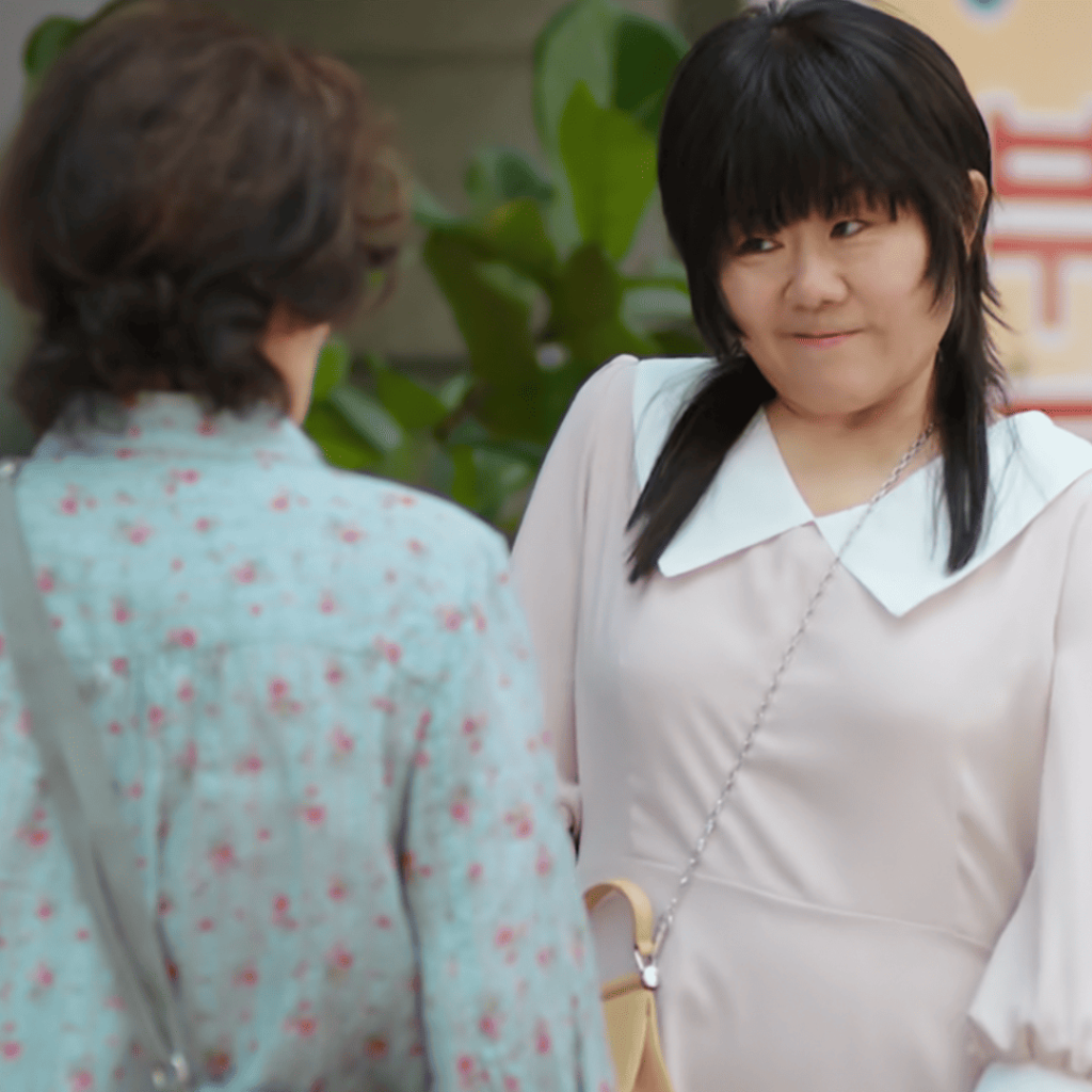 Heavenly Ever After: a person in a white dress talking to another person