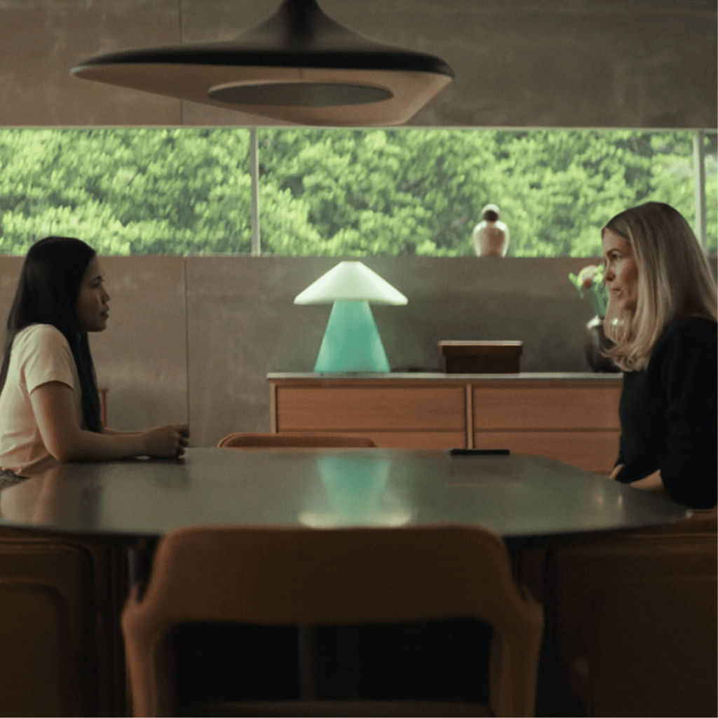 Secrets We Keep: Angel and Cecile face off across a table as Cecile fires her