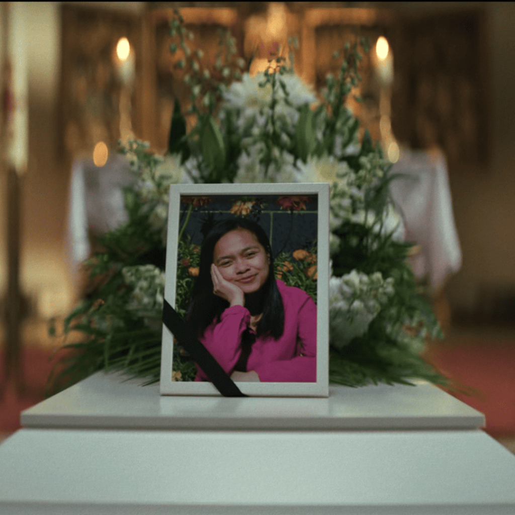 Secrets We Keep: A framed photo of Ruby sits atop her closed casket during the funeral.