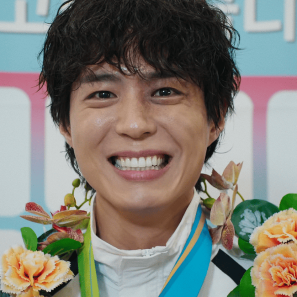 Good Boy Kdrama First Impressions: Close-up of Park Bo-gum smiling with floral medals and a wide grin