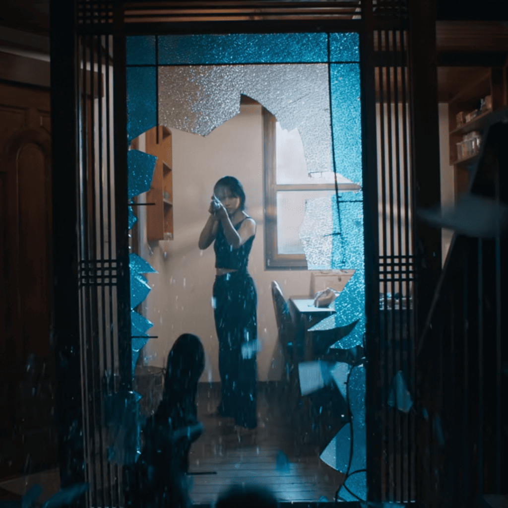 Good Boy Kdrama First Impressions: A woman pointing a gun through a shattered glass doorway as blue light filters through