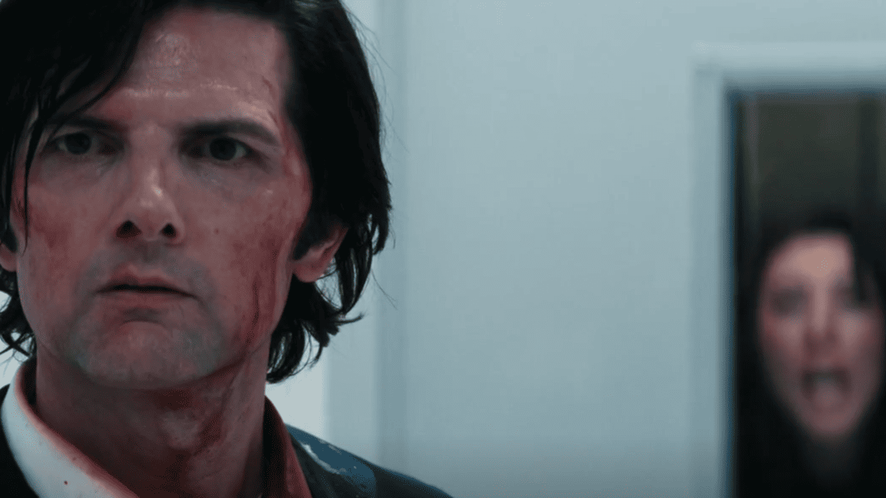 Severance Season 2 Identity: Innie Mark, bloodied and exhausted stands with his back to Gemma