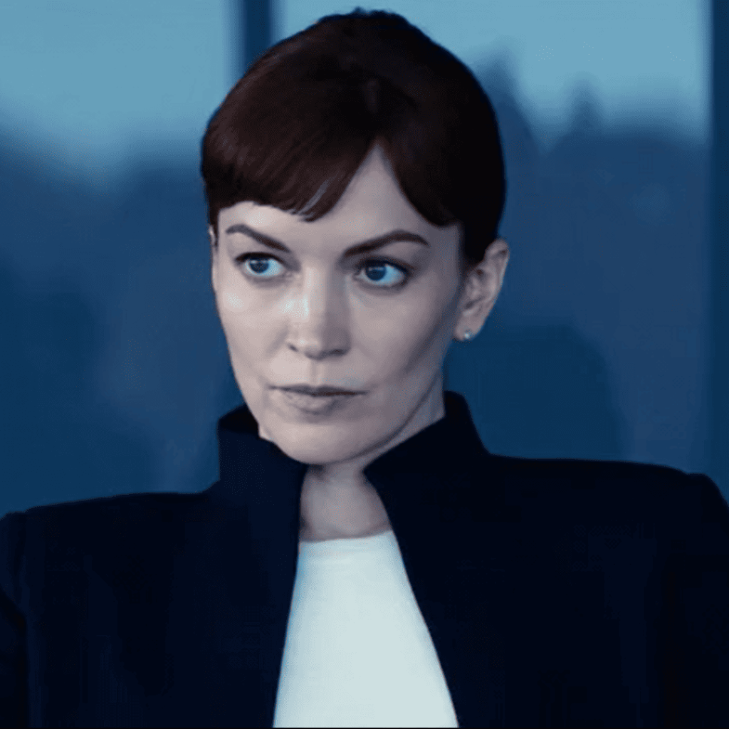 Severance Season 2 Identity: Close up Helena Eagon sitting before the board