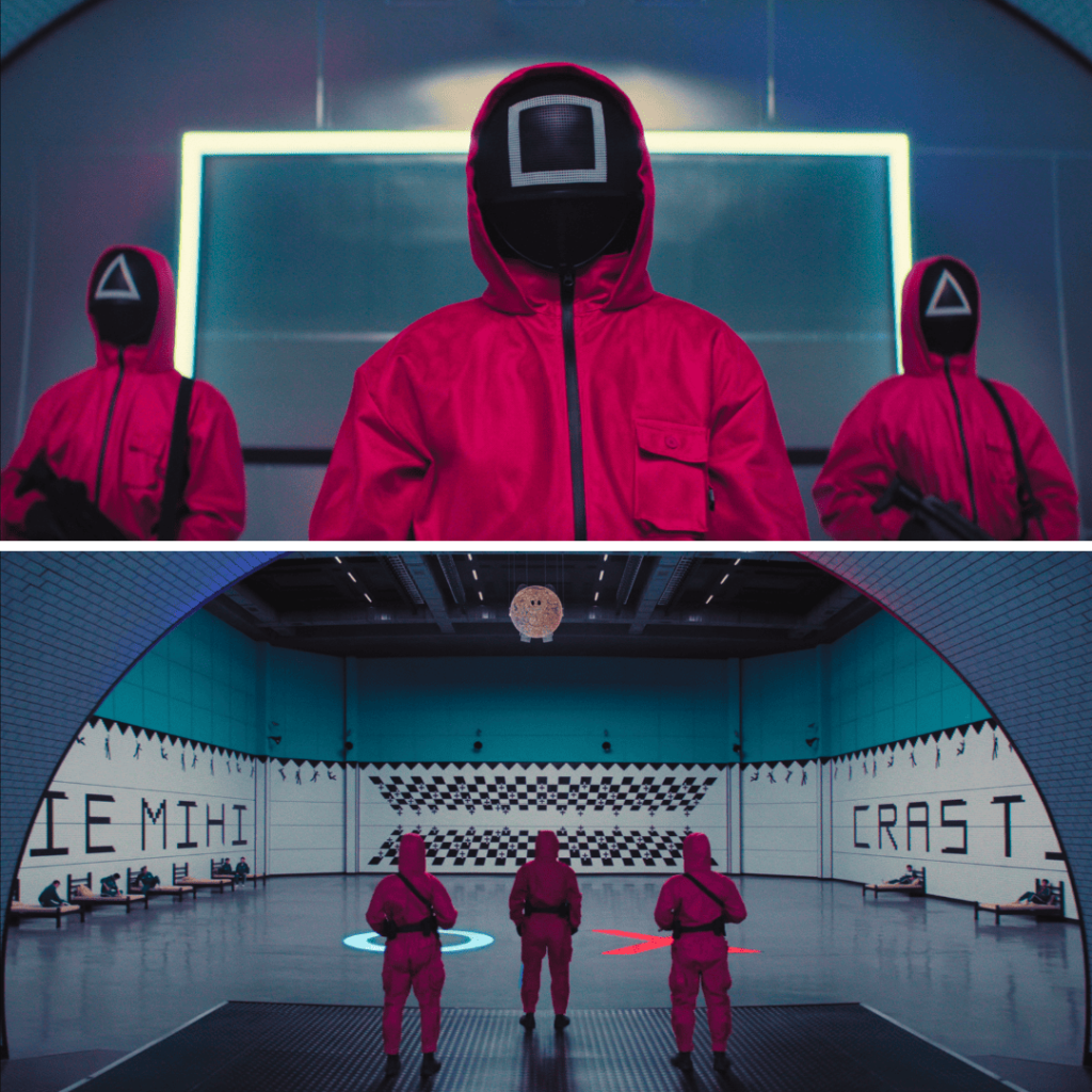 Masked guards in pink suits stand watch in Squid Game 3 arena