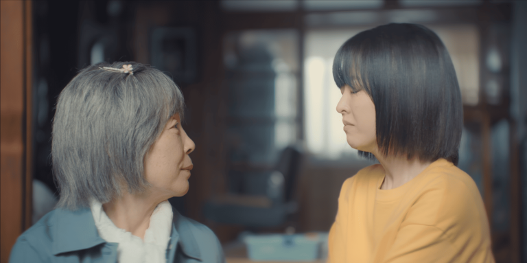 Our Unwritten Seoul Review: Miji's grandmother visits her in her dream to say goodbye as they sit side by side on the veranda