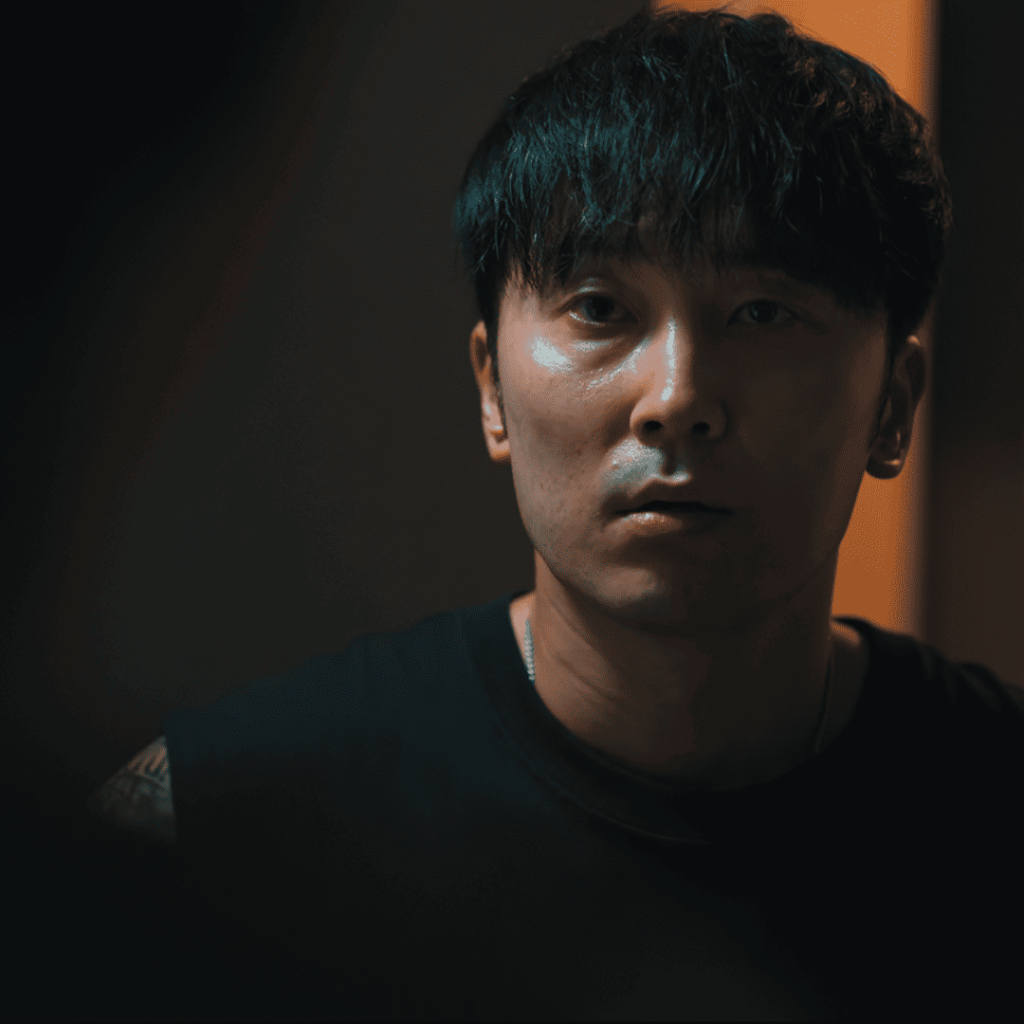 Man stares into the dark in Wall to Wall Movie Review, tension rising.