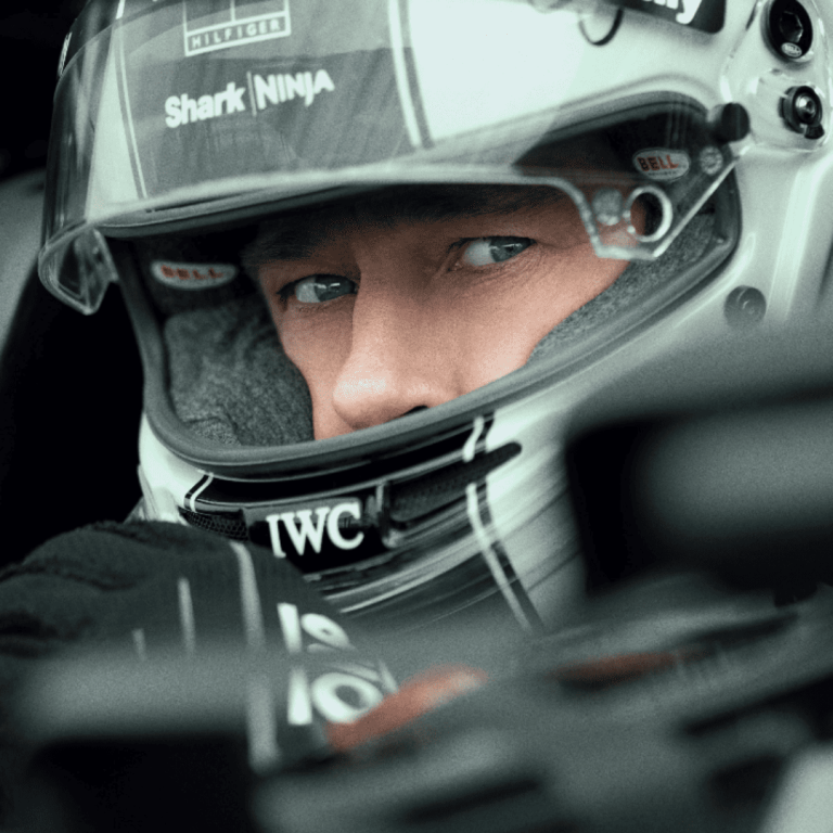 F1 Movie Review: Brad Pitt in an F1 helmet in a promotional poster