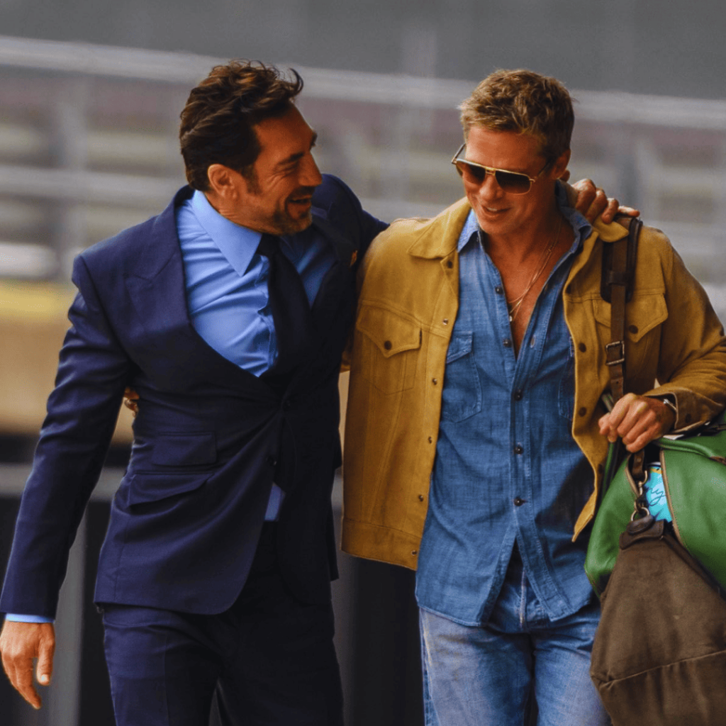 Brad Pitt and Javier Bardem walking side by side for the F1 movie review.