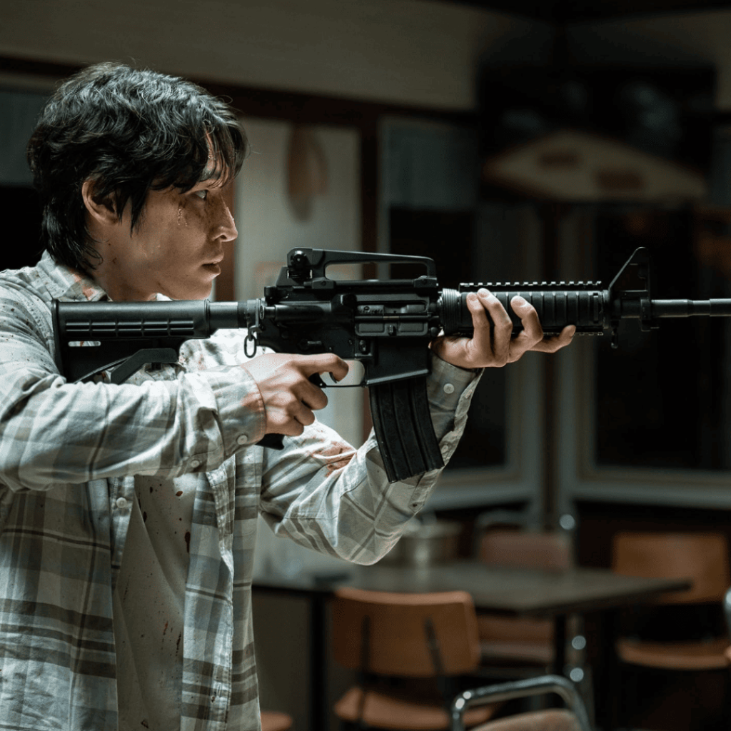 Jeong Tae holding a firearm in Trigger K-drama Episodes 1-5 Review.