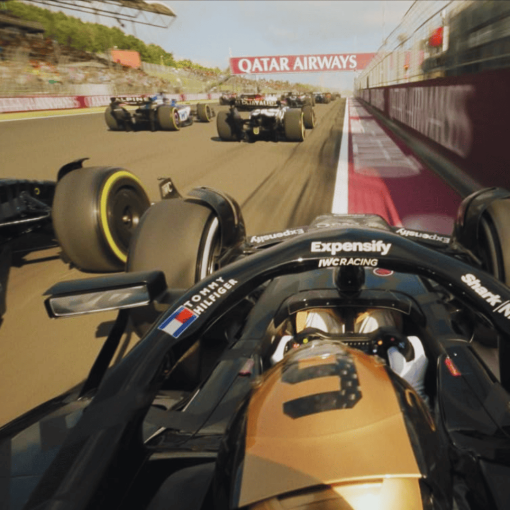 F1 car racing on track with dramatic action for the F1 movie review.