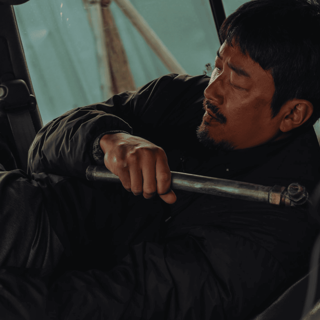 Nocturnal Movie Review fight scene with Ha Jung-woo battling inside a car, symbolizing the relentless grip of revenge.