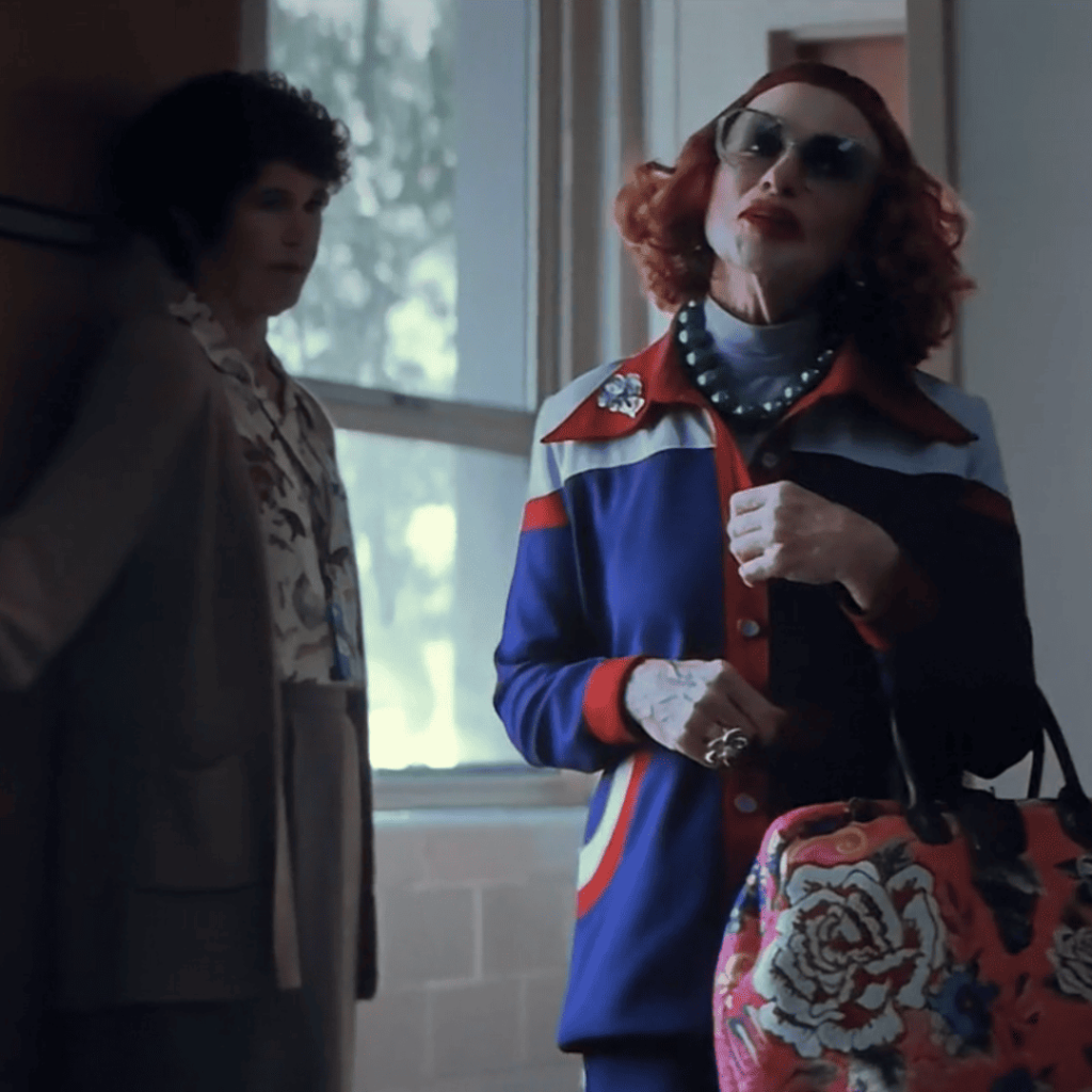 Weapons Movie Review image of Aunt Gladys visiting Alex’s school to meet the principal.