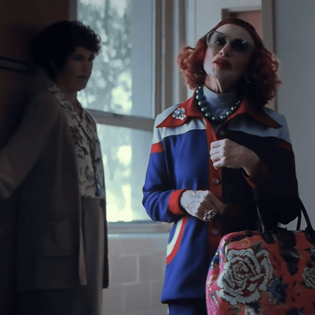 Weapons Movie Review image of Aunt Gladys visiting Alex’s school to meet the principal.