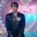 Typhoon Family First Impressions still of Kang Tae Pung on stage during a dating TV show, standing in front of a glowing red heart