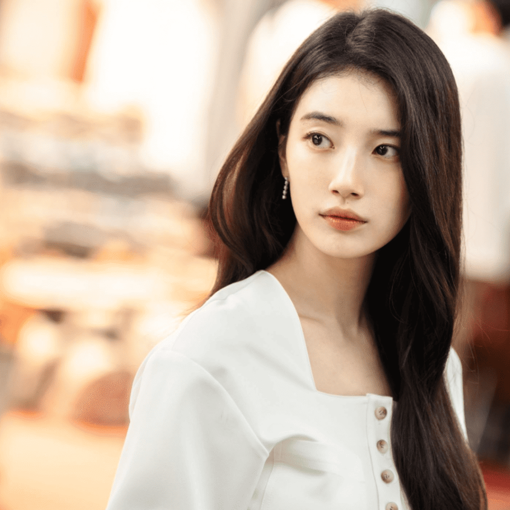 “Genie Make-A-Wish Kdrama Review still of Ka-young dressed in white, capturing her emotionless yet hauntingly calm expression