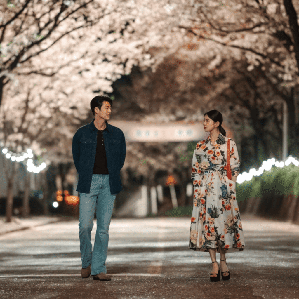 Genie Make-A-Wish Kdrama Review still of Iblis and Ka-young walking under cherry blossoms.