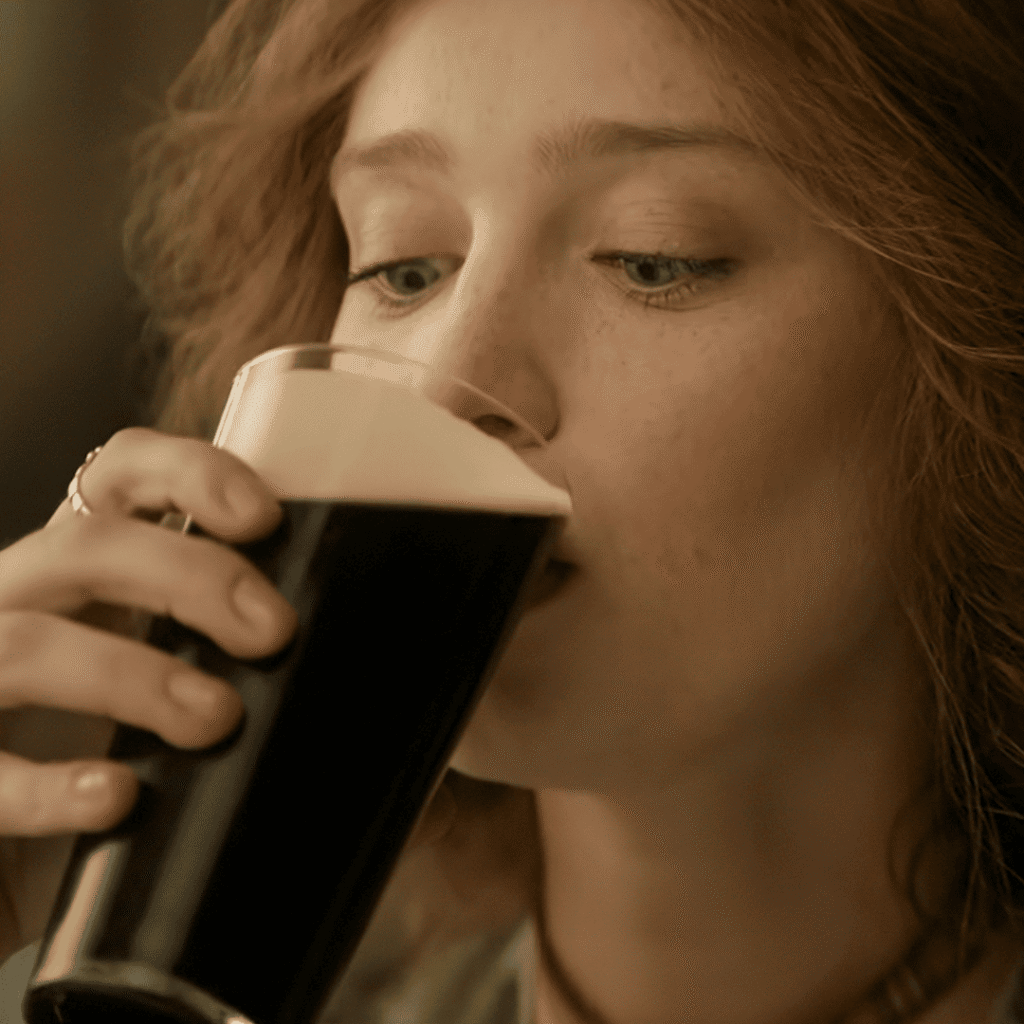 The House of Guinness Netflix Review: Ellen Cochrane quietly drinking a pint of Guinness, reflecting on the cost of devotion and changing a nation