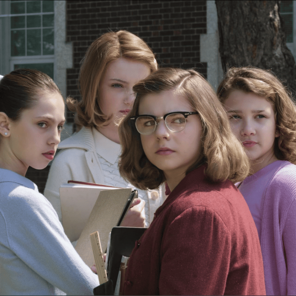IT Welcome to Derry Review: Still image of Marge and classmates watching Veronica and Lily argue outside the school