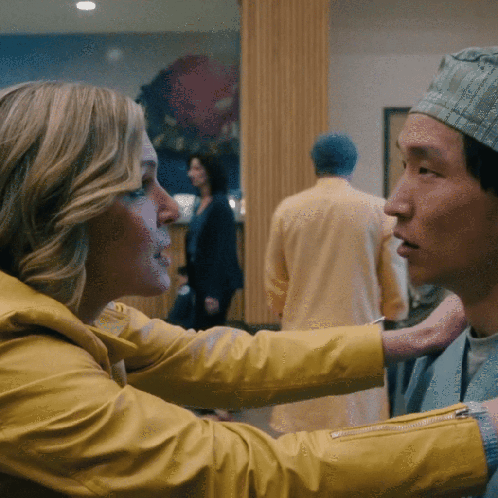 Pluribus Review: Carol and a doctor face to face in a hospital while the everyone glitches.