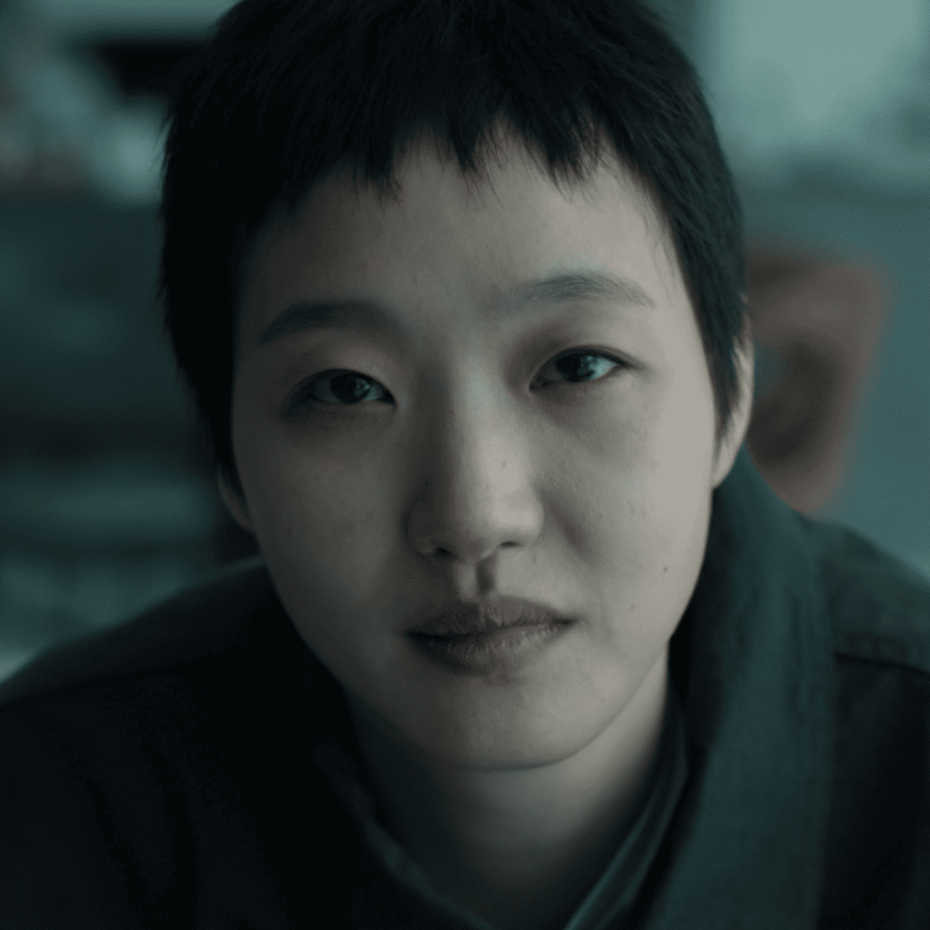 The Price of Confession Review: close up of Mo Eun watching Yun-su on television from her sofa