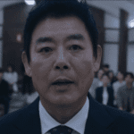 Bloody Flower Review: close up of Park Han-jun fighting for the defense