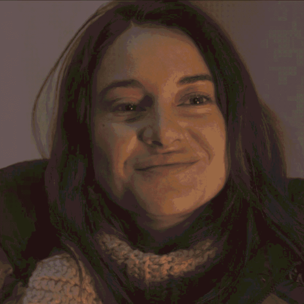 Paradise Season 2 Mid-Season Review Episodes 1-4: close-up of Annie smiling on the balcony at Graceland as she adjusts to life after the disaster.