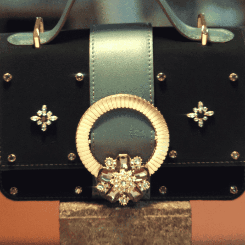 A close-up of the specific Boudoir bag crafted by Mi-jeong, representing the legacy in The Art of Sarah Character Analysis.