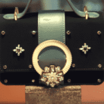 A close-up of the specific Boudoir bag crafted by Mi-jeong, representing the legacy in The Art of Sarah Character Analysis.