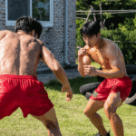 eon-woo and Woo-jin in their red training shorts, preparing for the final showdown discussed in this Bloodhounds Season 1 Recap.