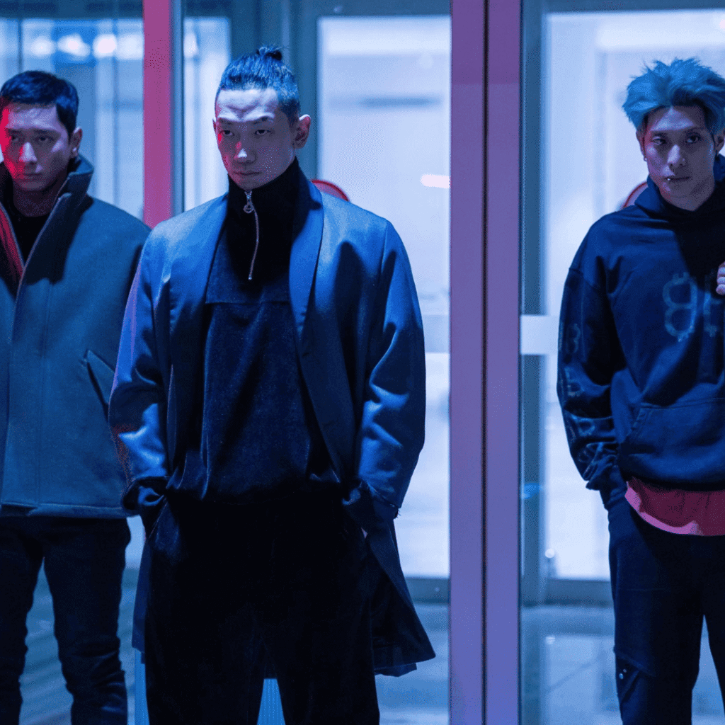 A still from the Bloodhounds Season 2 Review featuring the "three amigos" of the syndicate: Im Baek-jeong, the explosive expert Yun Tae-geom, and the hacker Allen.
