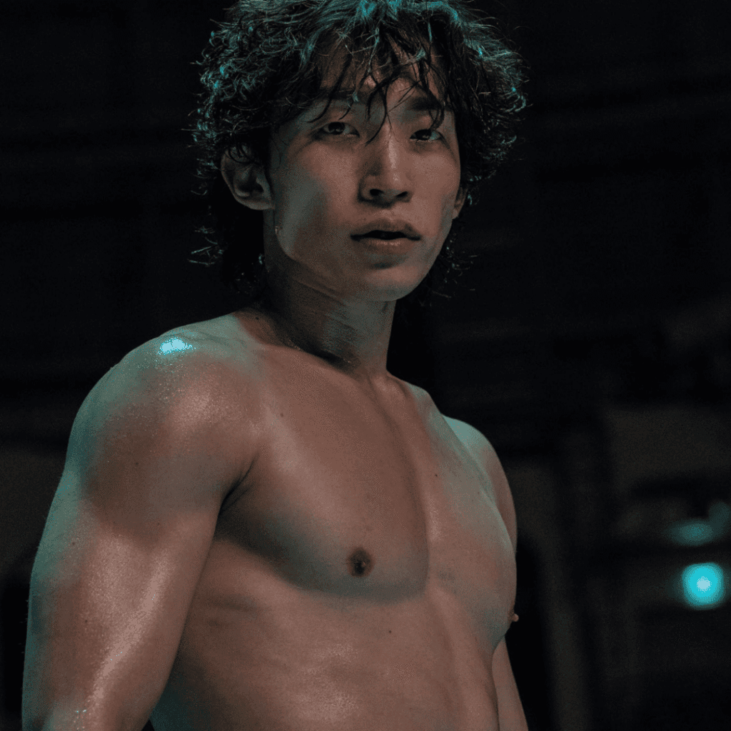 A close-up still of a shirtless and battle-worn Woo-jin in the ring for the final section of our Bloodhounds Season 2 Review.