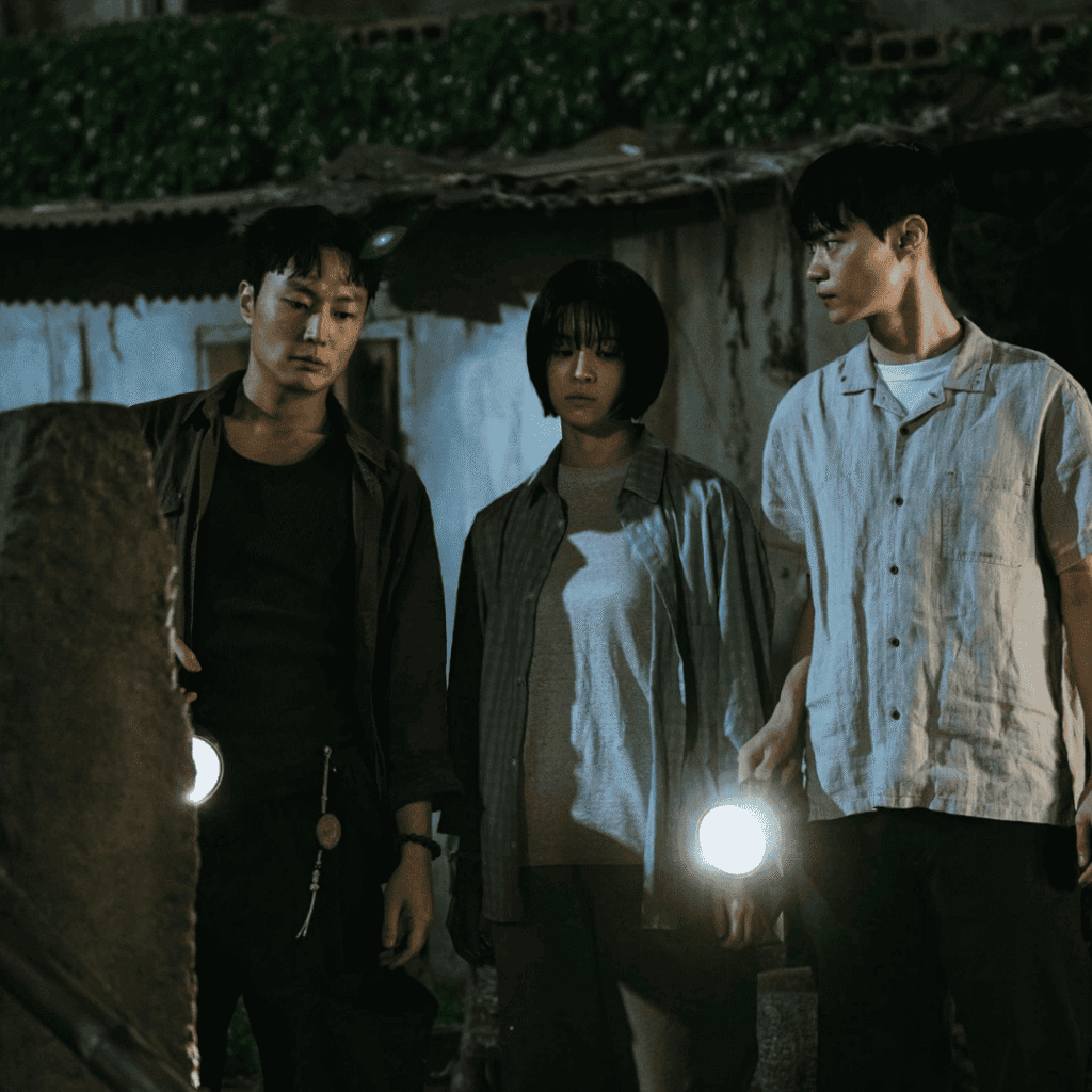 A still for the If Wishes Could Kill Review featuring Se-ah, Ha-joon, and Bang Oi as they search for the physical source of the digital curse.